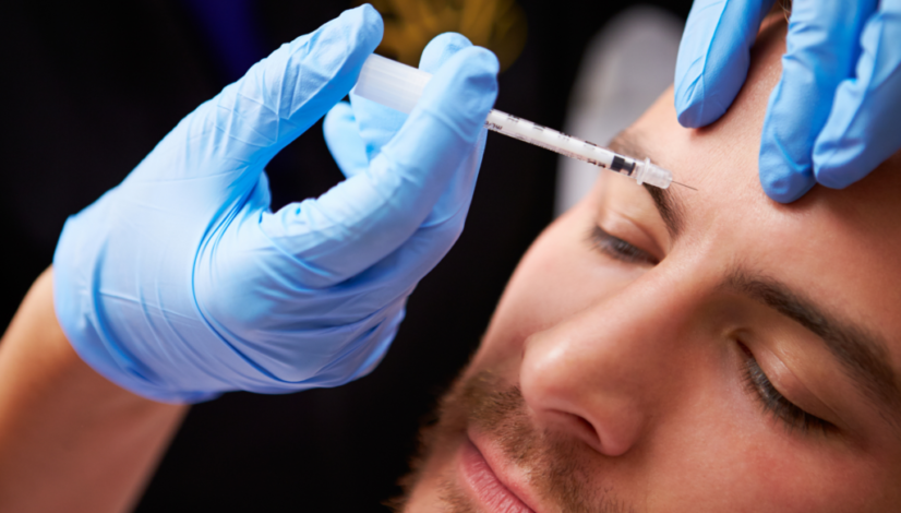 A man receives a syringe of Xeomin for anti-aging treatment after comparing Xeomin vs Botox.